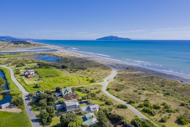 Aerial shot of Otaki Beach in New Zealand showing Kapiti island in the distance