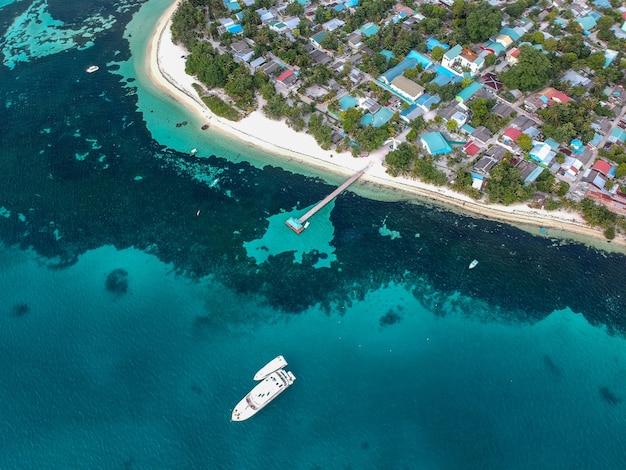 Aerial shot of a ship leaving the port