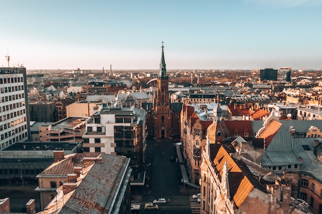 Aerial shot of St. Gertrude Church on background of Riga, Latvia