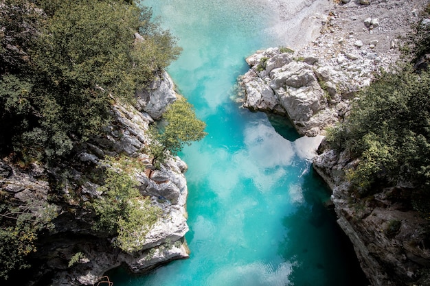 Aerial shot of the Valbona Valley National Park with reflecting waters in Albania