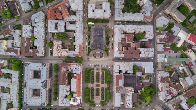 Aerial summer view of central part of beautiful ancient ukrainian city Chernivtsi with its streets, old residential buildings, town hall, churches etc. Beautiful town.