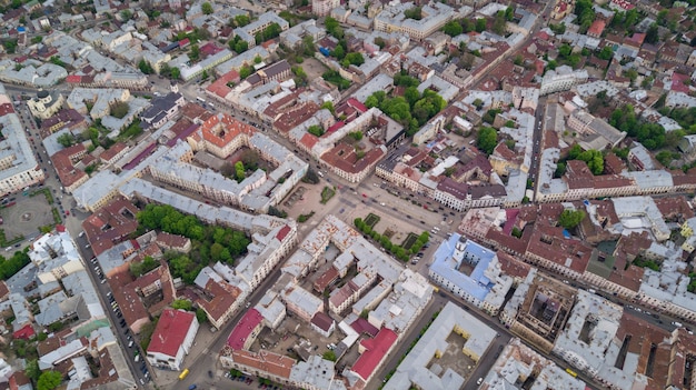 Free photo aerial summer view of central part of beautiful ancient ukrainian city chernivtsi with its streets, old residential buildings, town hall, churches etc. beautiful town