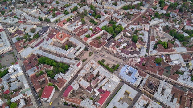 Aerial summer view of central part of beautiful ancient ukrainian city Chernivtsi with its streets, old residential buildings, town hall, churches etc. Beautiful town