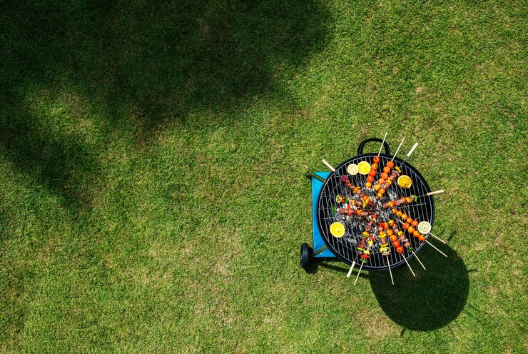 Free Photo aerial view of barbecues steaks on the charcoals grill