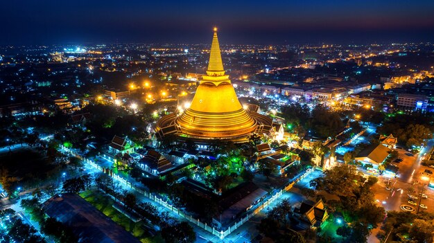 Aerial view of Beautiful Gloden pagoda at night. Phra Pathom Chedi temple in Nakhon Pathom Province, Thailand.