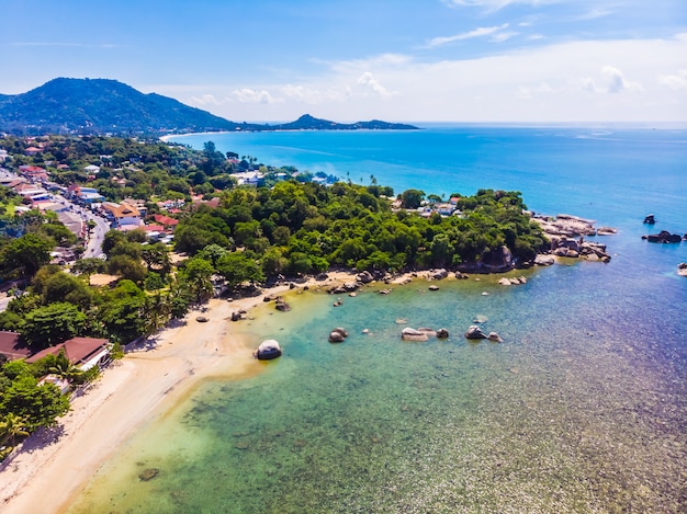 Aerial view of beautiful tropical beach and sea with palm and other tree in koh samui island