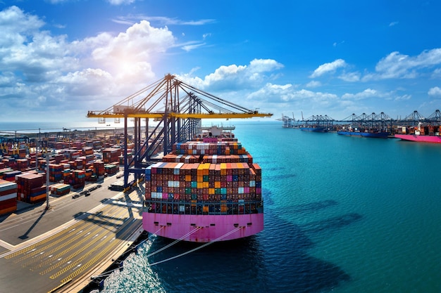 Aerial view of cargo ship and cargo container in harbor