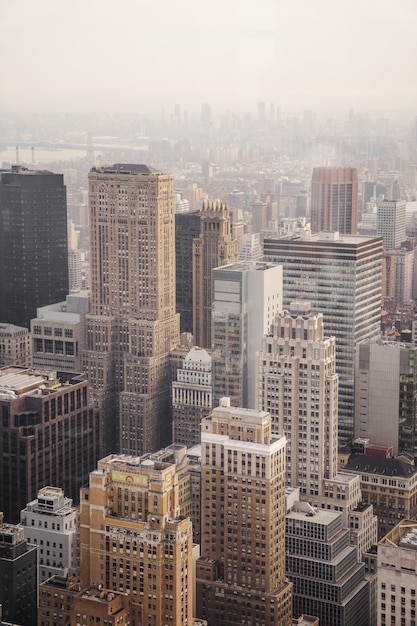 Free photo aerial view of city under cloudy sky during day time