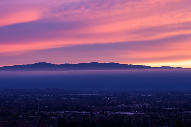 Aerial view of city during sunset