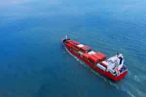 Free photo aerial view of container cargo ship in sea.