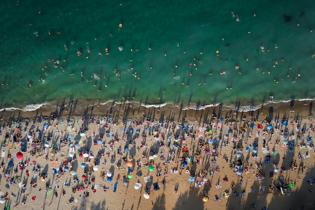 Aerial view of crowd of people on the beach