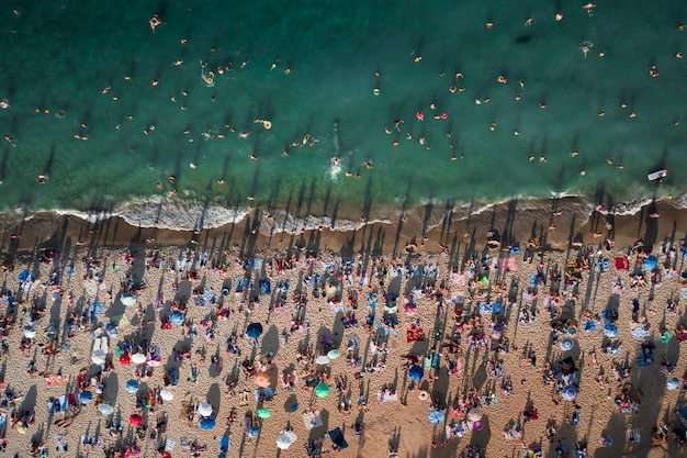 Aerial View Of Crowd Of People On The Beach