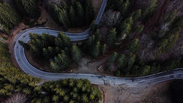 Aerial view of a curved road in a countryside