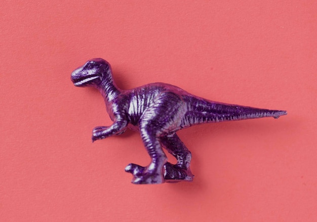 Free photo aerial view of dinosaur toy with colorful background