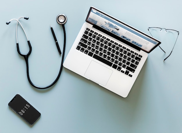 Aerial view of doctor stethoscope and computer laptop