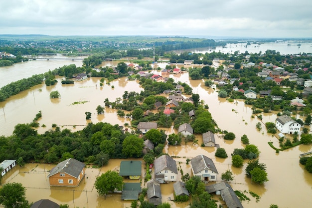 Aerial view of flooded houses with dirty water of dnister river in halych town, western ukraine.