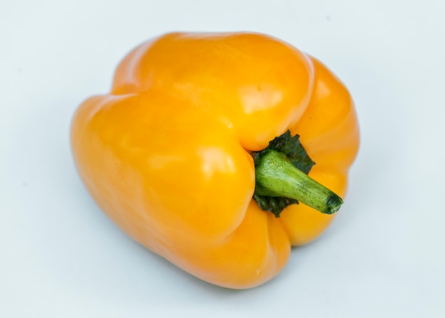 Aerial view of fresh sweet peppers on white background