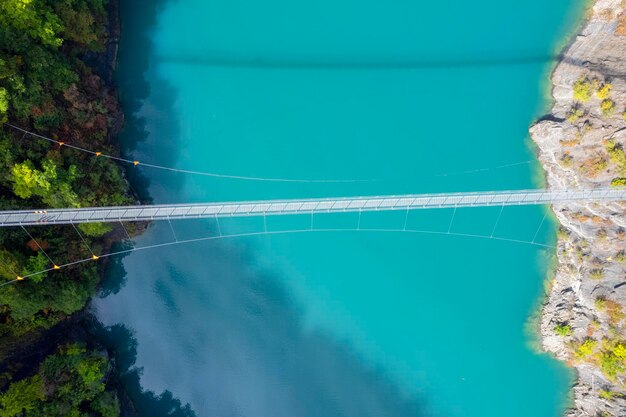 Aerial view of himalayan footbridge crossing the Drac near Lake Monteynard