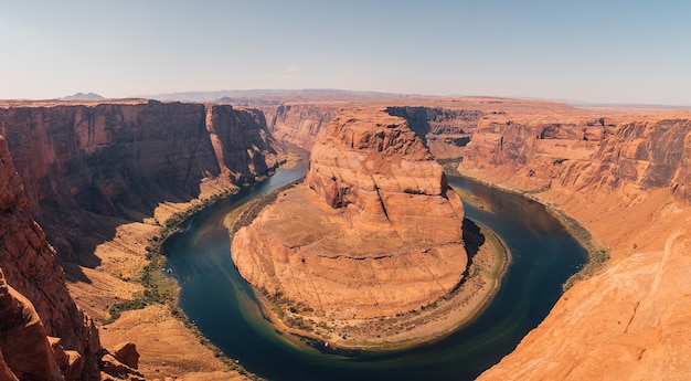 Aerial view of the Horseshoe Bend is a famous meander on the river with a blue sky