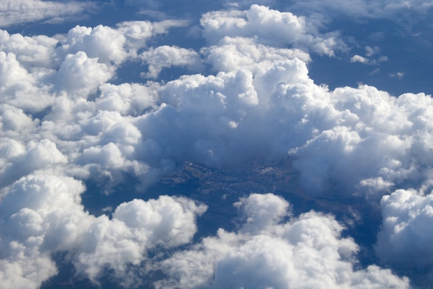An aerial view of large cumulus clouds in the air
