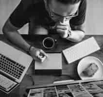 Free photo aerial view of man working on computer