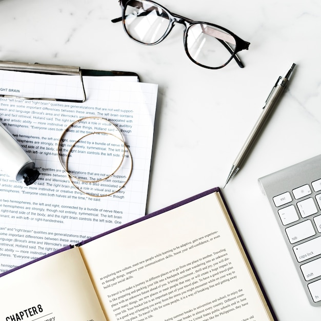 Free photo aerial view of novel on white marble table