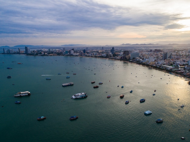 Aerial view of Pattaya beach as the sun rises over the ocean. Thailand.