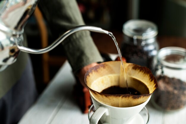 Aerial view of a person making drip coffee