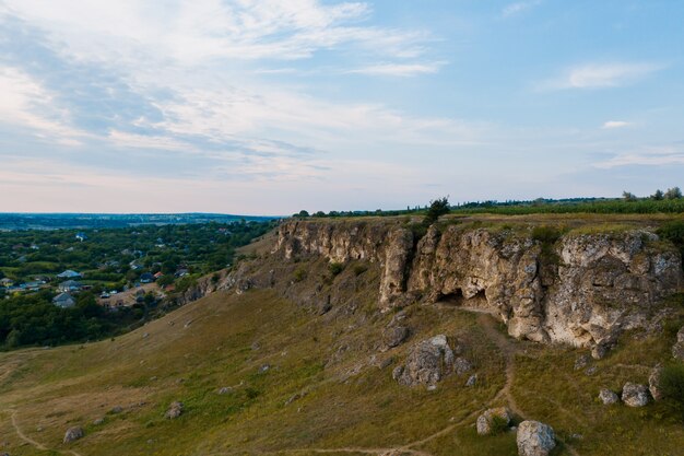 Aerial view of the picturesque landscape of land, trees, rocks, sky reflected in to the water.