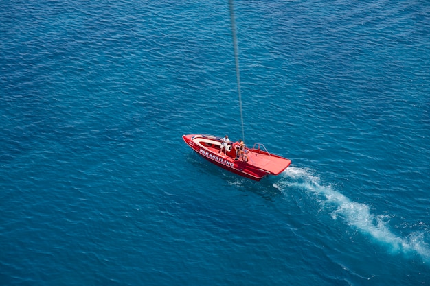 Free photo aerial view of red speedboat