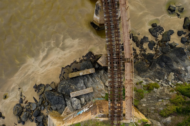 Free photo aerial view of a road-rail bridge