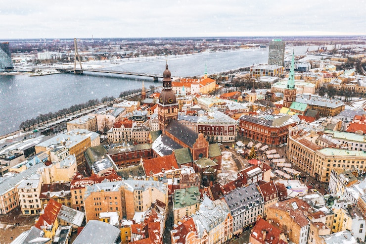 Free Photo aerial view of the rooftops of the old city in riga, latvia in winter