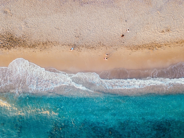 Aerial view of the sandy coast of the turquoise sea