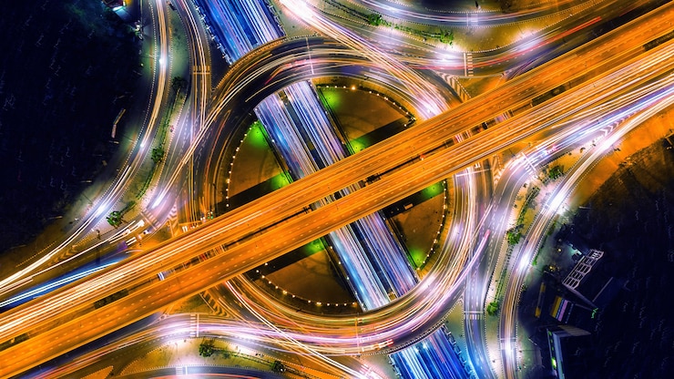Free Photo aerial view of traffic in roundabout and highway at night.