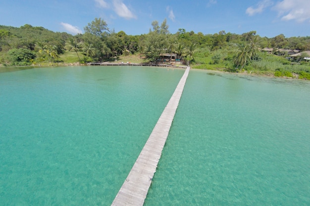 Aerial view of a tropical island in turquoise water. Luxurious over-water villas on tropical Kood island, for holiday vacation background concept -Boost up color Processing.