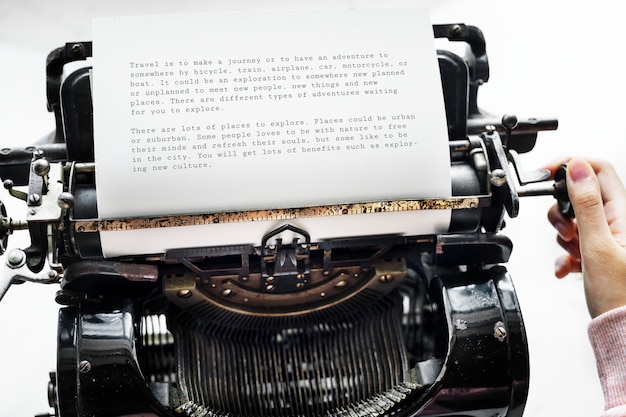 Aerial view of a woman typing on a retro typewriter