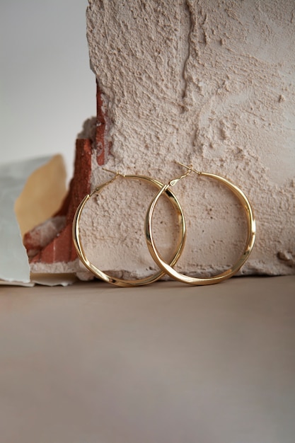 Free photo aesthetic golden hoop earrings assortment