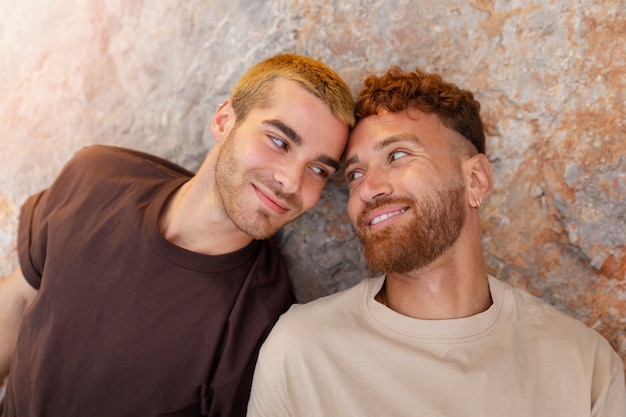 Free photo affectionate gay couple spending time together on the beach