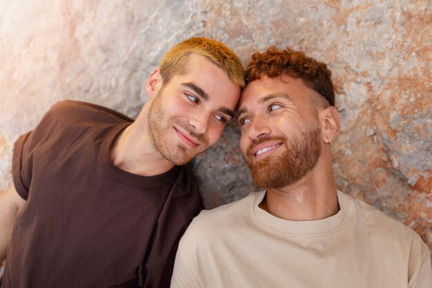 Affectionate gay couple spending time together on the beach