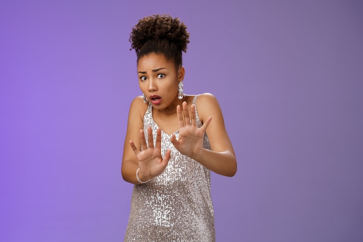 Free Photo afraid worried insecure african-american woman begging mercy please stop scared friend spill drink her luxurious silver expensive dress raising palms frightened widen eyes terrified shaking.
