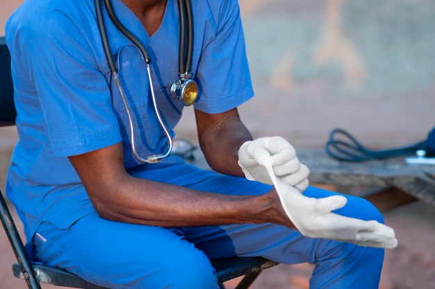 Africa humanitarian aid doctor getting ready for work