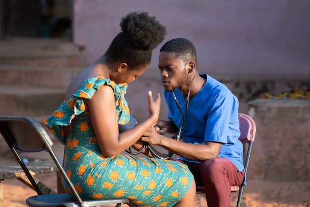 Free photo africa humanitarian aid doctor taking care of patient