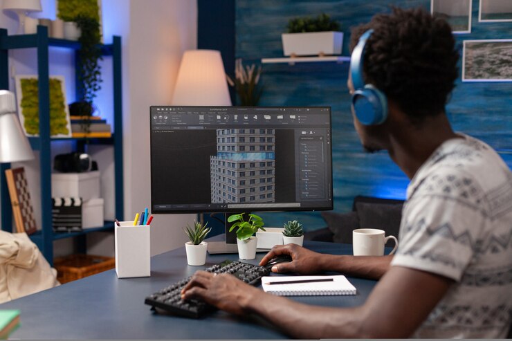 Free Photo african american architect man analyzing corporate building plan on computer