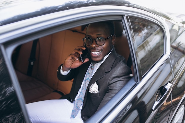African american business man in car