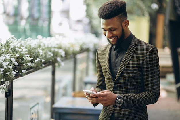 Free photo african american business man outside cafe