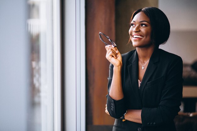 African american business woman by the window