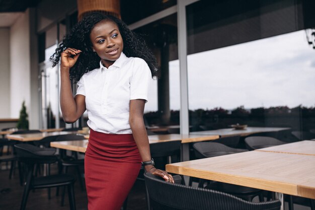 African american business woman on a cafe balcony