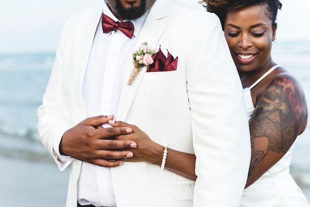 African American couple getting married at an island