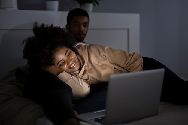 African american couple watching streaming service together