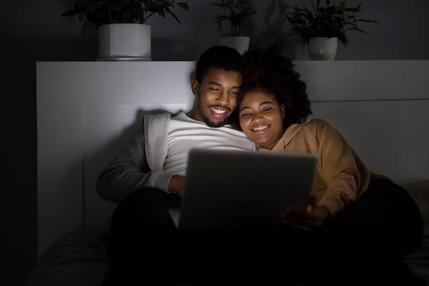 African american couple watching streaming service together